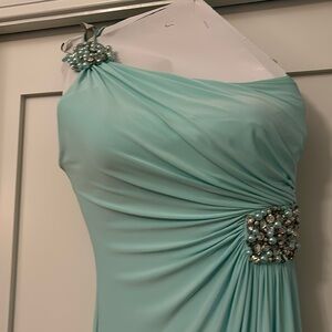 Beautiful blue/green formal with embellishments. Very classy and great fit.